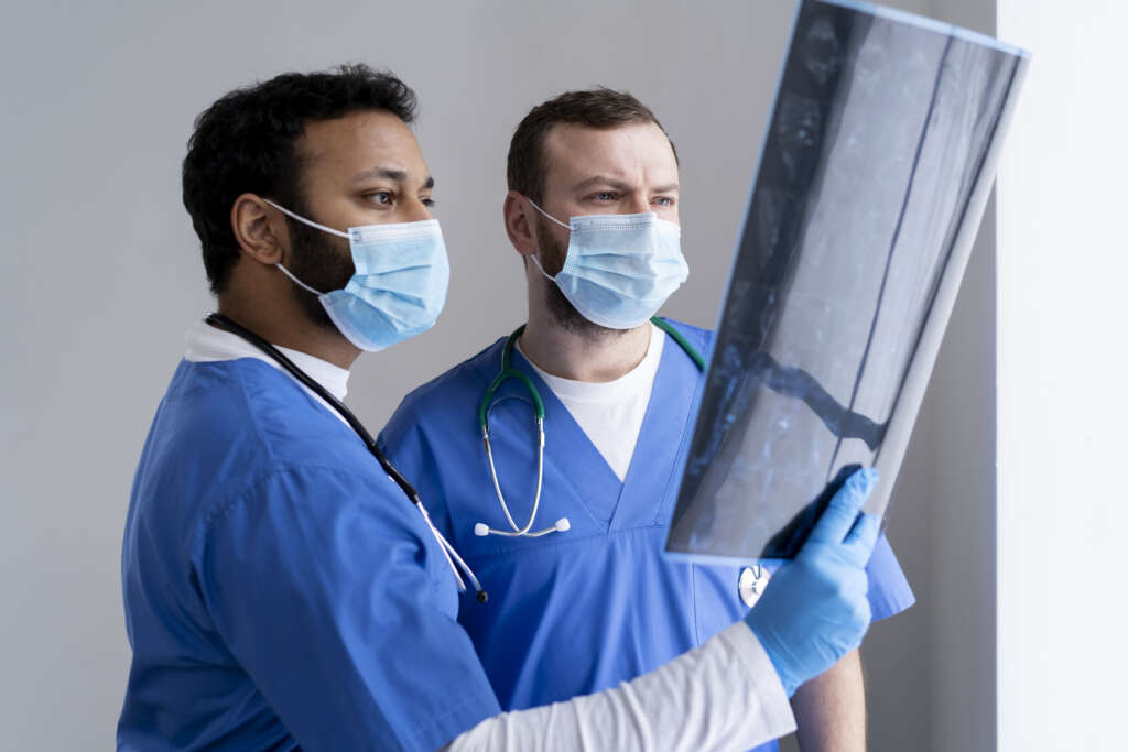 medium-shot-nurses-looking-radiography